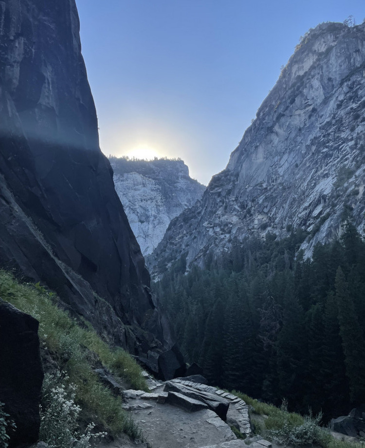 <img alt=" sunrising over granite mountains on the mist trail in Yosemite National Park.">